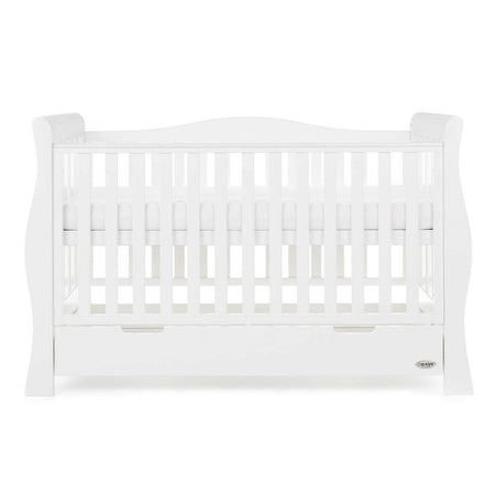 Obaby Stamford Luxe Sleigh Cot Bed with Drawer (White) - front view, shown with the mattress base at its highest level