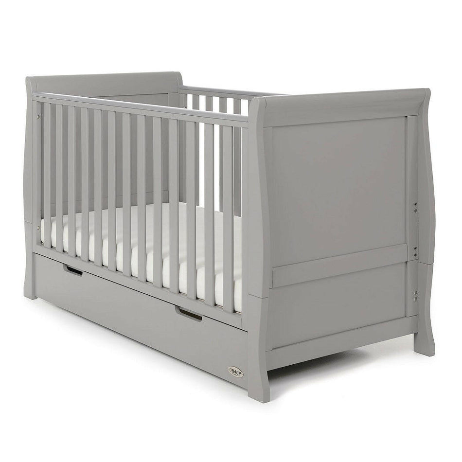 Obaby Stamford Sleigh Cot Bed with Drawer (Warm Grey) - quarter view, shown with the mattress
