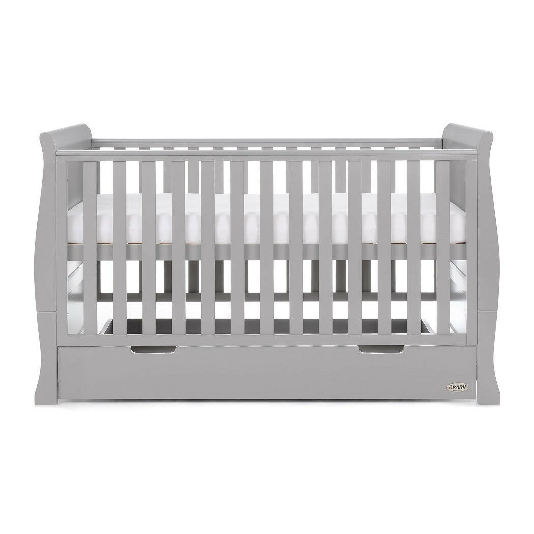 Obaby Stamford Sleigh Cot Bed (Warm Grey) - side view, shown with the mattress base at its highest level