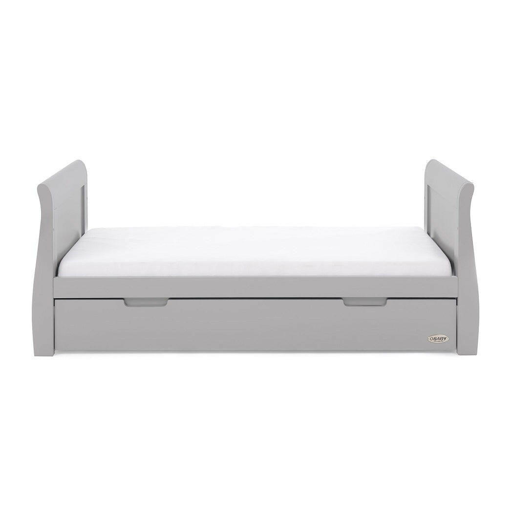 Obaby Stamford Sleigh Cot Bed (Warm Grey) - side view, showing the junior bed with mattress