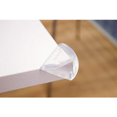 Safety 1st Soft Corner Guards - Pack of 4 (Clear) - lifestyle image, shown fitted to a table`s corner