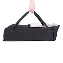 Phil & Teds XL COCOON Soft Carrycot (Black) - side view, showing the cocoon being carried