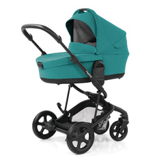 BabyStyle Hybrid 2 Carrycot (Lagoon) - quarter view, showing the carrycot and stroller chassis in use as the pram (stroller available separately) 