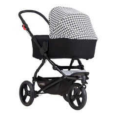 Mountain Buggy Swift & MB Mini Carrycot Plus (Pepita) - quarter view, shown here on a chassis (pushchair not included, available separately)