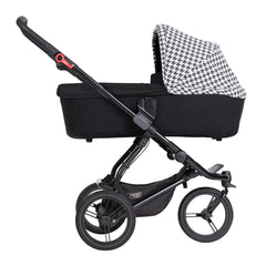 Mountain Buggy Swift & MB Mini Carrycot Plus (Pepita) - side view, shown here on a chassis (pushchair not included, available separately)
