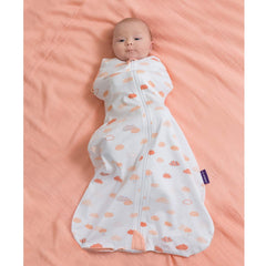 Clevamama 3-in-1 Nite Nite Romper (Coral Clouds) - lifestyle image, shown here swaddling a baby