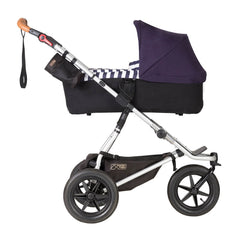 Mountain Buggy Urban Jungle - Luxury Collection Bundle (Nautical) - side view, showing the carrycot and chassis in use as the pram