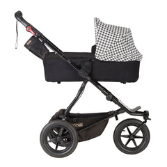 Mountain Buggy Urban Jungle - Luxury Collection Bundle (Pepita) - side view, showing the carrycot and chassis in use as the pram