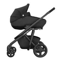 Maxi-Cosi Jade i-Size Car Cot (Essential Black) - side view, showing the Jade fixed onto Maxi-Cosi`s Adorra Pushchair Chassis (Adorra not included, available separately)