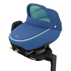 Maxi-Cosi Jade i-Size Car Cot (Essential Blue) - quarter view, showing the Jade fixed onto an ISOFIX base (base not included, available separately)