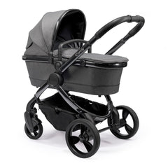 iCandy Peach Phantom Pushchair & Carrycot (Dark Grey Twill) - quarter view, showing the carrycot and chassis together as the pram