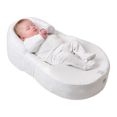 Red Castle Cocoonababy Pod Support Nest (White) - showing the Cocoonababy with a sleeping infant with the tummy band holding baby