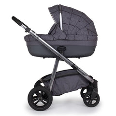 Cosatto Wow Continental Carrycot (Fika Forest) - side view, showing the carrycot fitted onto the pushchair`s chassis (pushchair not included, available separately)