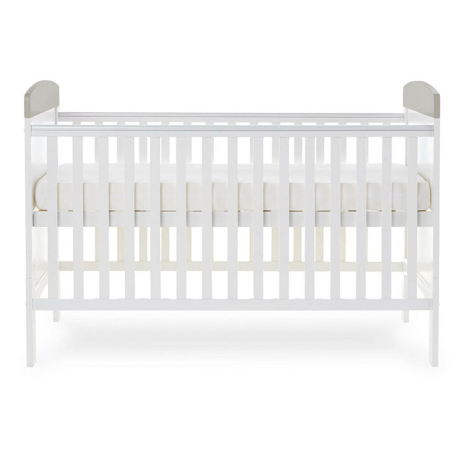 Obaby Grace Inspire Cot Bed (Me & Mini Me Elephants - Grey) - side view, showing the mattress base at its highest level (mattress not included, available separately)