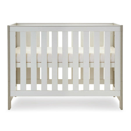 Obaby Nika Mini Cot Bed (Grey Wash & White) - side view, shown here with the mattress base at its highest level (mattress not included, available separately)