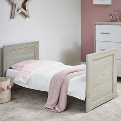 Obaby Nika Mini Cot Bed (Grey Wash & White) - lifestyle image, shown here with the toddler bed (matching changing unit not included, available separately)