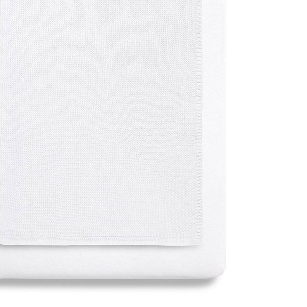 SnuzPod 3-Piece Bedding Set - Crib (White) - showing the blanket and a sheet fitted to a mattress (mattress not included, available separately)