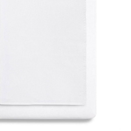 SnuzPod 3-Piece Bedding Set - Crib (White) - showing the blanket and a sheet fitted to a mattress (mattress not included, available separately)