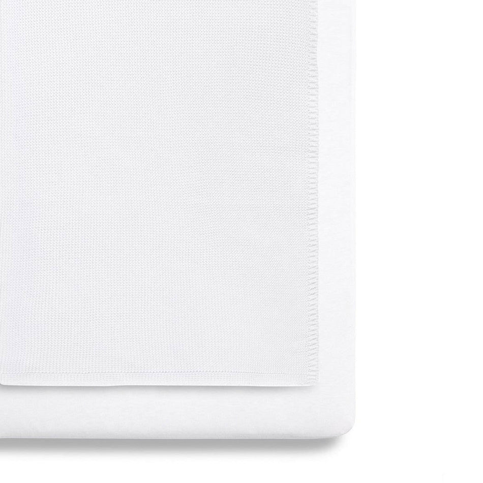 SnuzPod 3-Piece Bedding Set - Crib (White) - showing the blanket and a sheet fitted to a mattress (mattress not included, available separately)
