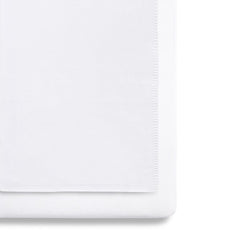 SnuzPod 3-Piece Bedding Set - Crib (White) - showing the blanket and a sheet fitted to a mattress (mattress not included, available separately)