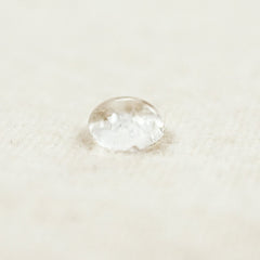 SnuzPod2 Waterproof Crib Mattress Protector - showing water sitting on top of the protector