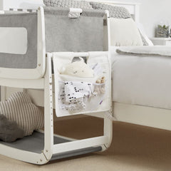 SnuzPod Storage Pocket (White) - lifestyle image, showing the storage pocket fitted to a SnuzPod (crib not included, available separately)
