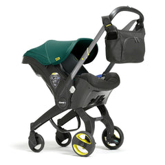 Doona Essentials Bag (Black) - showing the bag attached to the stroller`s handlebar (Doona not included, available separately)