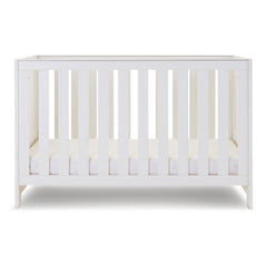 Obaby Nika Cot Bed (White Wash) - showing the cot with the mattress base at its lowest level (mattress not included, available separately)