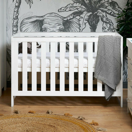 Obaby Nika Cot Bed (White Wash) - lifestyle image (mattress, bedding and accessories not included)
