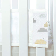 Breathable Baby Mesh Liner - 2 Sided (Cloud 9) - showing the hook`n`loop fastening being used to fit one of the panels to a cot