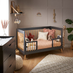 Obaby MAYA Cot Bed (White with Natural) - lifestyle image, shown here as junior bed with the safety rails (mattress, bedding and toys not included)