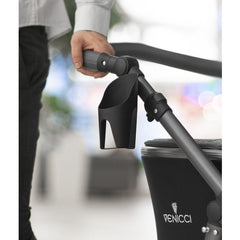 Venicci Cup Holder (Black) - lifestyle image, showing the cup holder attached to a pram (pram not included, available separately)