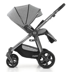 BabyStyle Oyster 3 Gunmetal ESSENTIAL Bundle (Moon) - side view, showing the parent-facing pushchair with the seat reclined