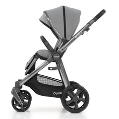 BabyStyle Oyster 3 Gunmetal ESSENTIAL Bundle (Moon) - side view, showing the forward-facing pushchair with its seat upright