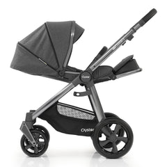 BabyStyle Oyster 3 Gunmetal ESSENTIAL Bundle (Fossil) - showing the parent-facing pushchair with seat reclined and leg rest raised