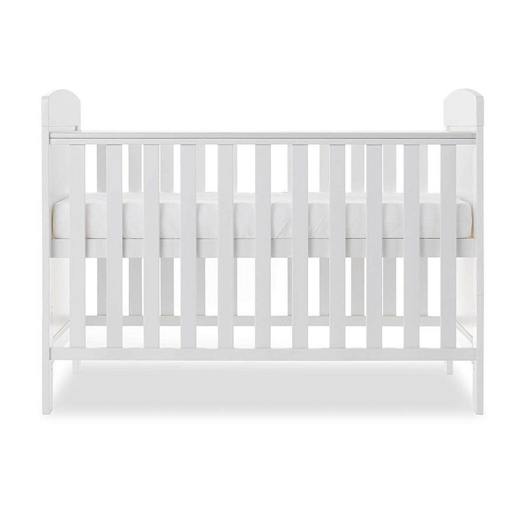 Obaby Grace Mini Cot Bed (White) - side view, shown with the mattress base at its highest level (mattress not included, available separately)