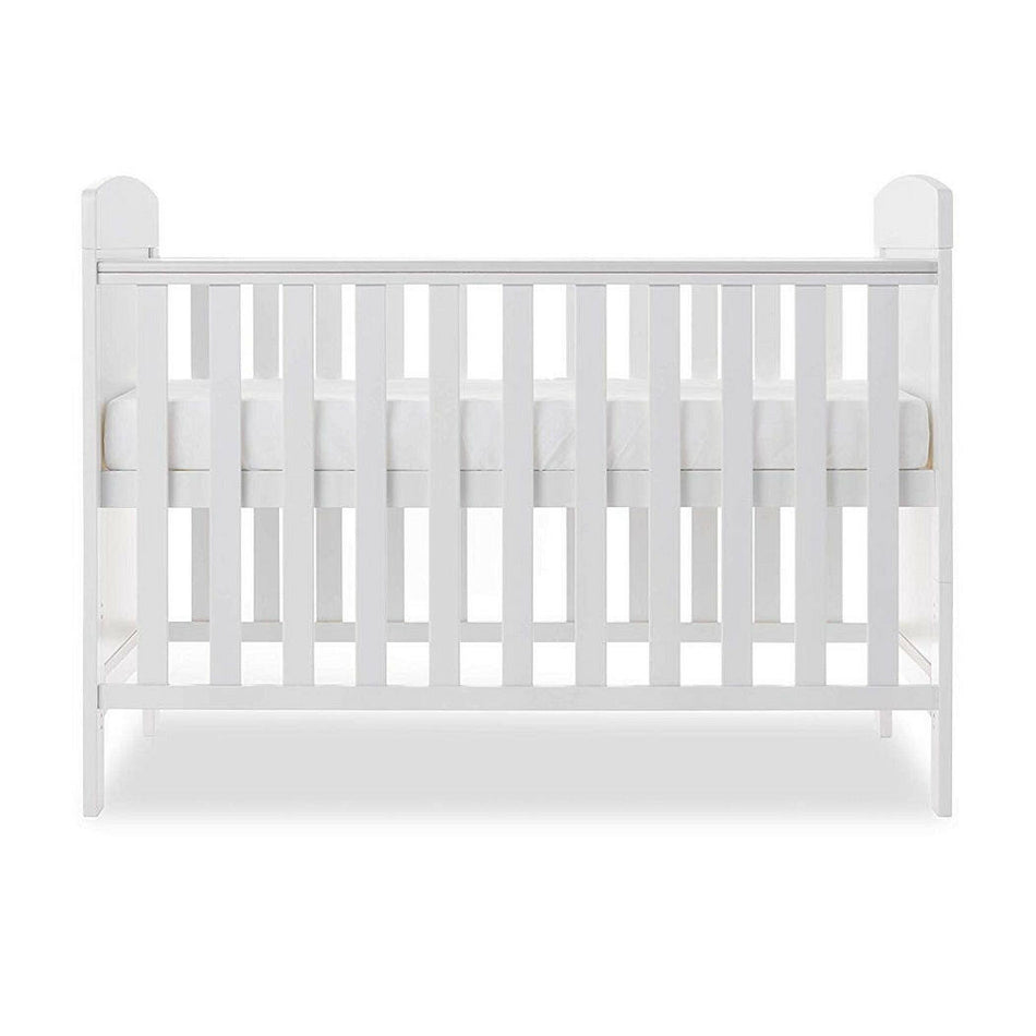 Obaby Grace Mini Cot Bed (White) - side view, shown with the mattress base at its highest level (mattress not included, available separately)