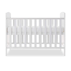 Obaby Grace Mini Cot Bed (White) - side view, shown with the mattress base at its highest level (mattress not included, available separately)