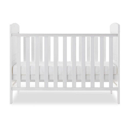 Obaby Grace Mini Cot Bed (White) - side view, shown with the mattress base at its middle level (mattress not included, available separately)