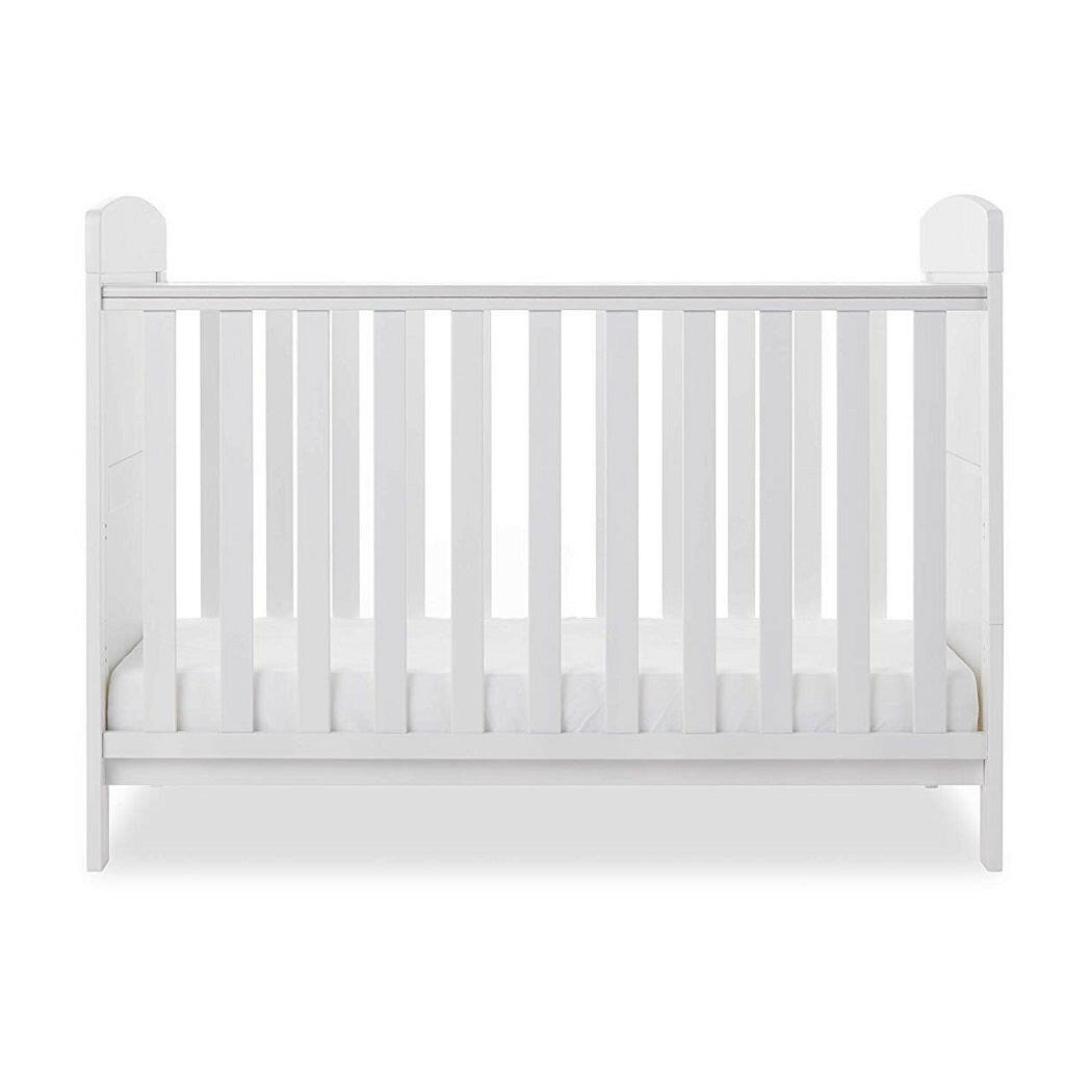Obaby Grace Mini Cot Bed (White) - side view, shown with the mattress base at its lowest level (mattress not included, available separately)