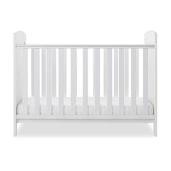 Obaby Grace Mini Cot Bed (White) - side view, shown with the mattress base at its lowest level (mattress not included, available separately)
