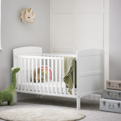 Obaby Grace Cot Bed (White) with Foam Mattress -lifestyle image (toys and accessories not included)