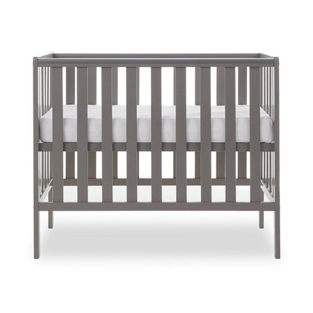 Obaby Bantam Space Saver Cot (Taupe Grey) - side view, shown with mattress base at its highest level (mattress not included, available separately)