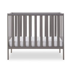 Obaby Bantam Space Saver Cot (Taupe Grey) - side view, shown with mattress base at its lowest level