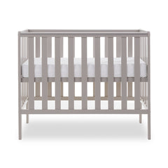 Obaby Bantam Space Saver Cot (Warm Grey) - side view, shown with mattress base at its highest level (mattress not included, available separately)