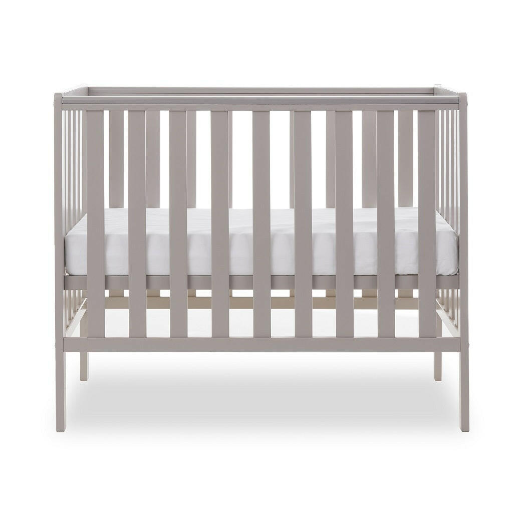 Obaby Bantam Space Saver Cot (Warm Grey) - side view, shown with mattress base at its middle level