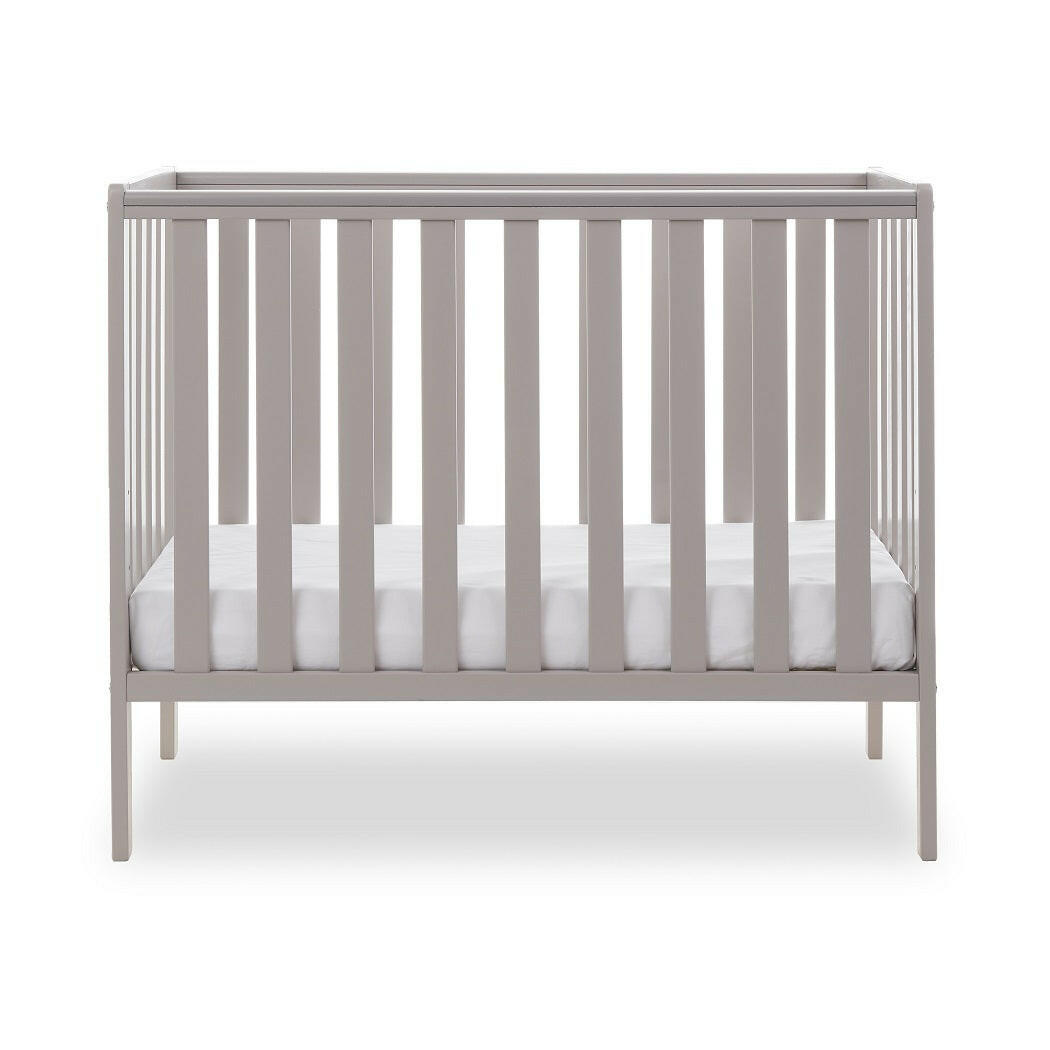 Obaby Bantam Space Saver Cot (Warm Grey) - side view, shown with mattress base at its lowest level