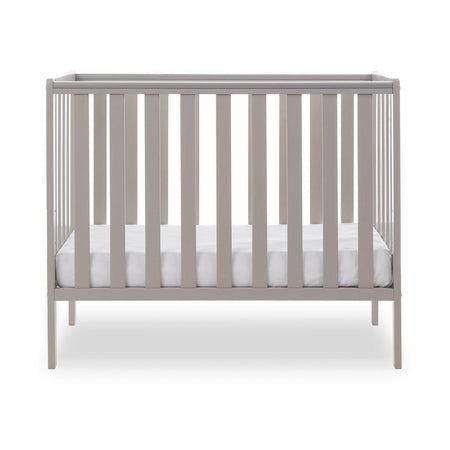 Obaby Bantam Space Saver Cot (Warm Grey) - side view, shown with mattress base at its lowest level