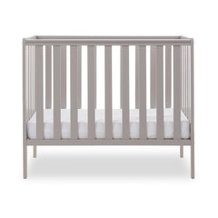 Obaby Bantam Space Saver Cot (Warm Grey) - side view, shown with mattress base at its lowest level