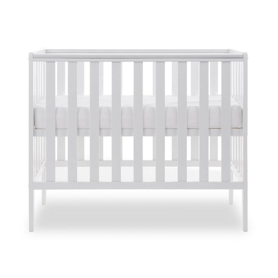 Obaby Bantam Space Saver Cot (White) - side view, shown with mattress base at its highest level (mattress not included, available separately)